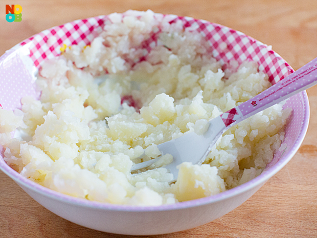 Mashing potato salad